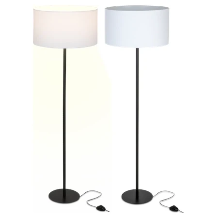 biała lampa stojąca na czarnej nodze